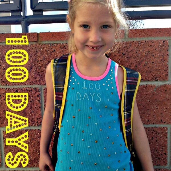 A young girl smiles brightly, donning a blue 100 DAYS shirt and a backpack. Text reads: "100 DAYS" and "Ideas 4 School." Perfect for those seeking 100 days of school shirt ideas!