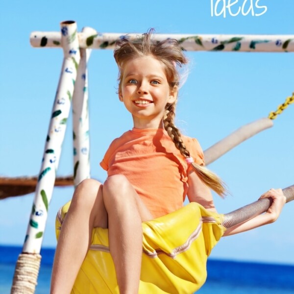 Child swinging joyfully on a rope swing at the beach, embodying the essence of summer staycation ideas, with "Staycation Ideas" text above.