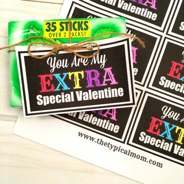 Pack of green gum with a tag reading You Are My Extra Special Valentine attached by twine, accompanied by extra special Valentine's Day printables featuring the same heartfelt message.