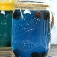 Mason jar filled with a vibrant blue liquid labeled as Hawaiian Punch, adorned with a charming twine bow. Baby Shower text elegantly displayed at the bottom.