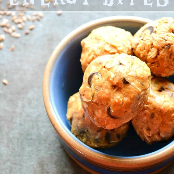 A bowl of no-bake energy bites sits on the table, boasting a delicious energy ball recipe. Text above reads No Bake Energy Bites.