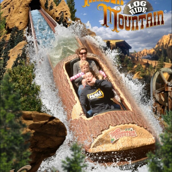 Three people ride a log flume descending a water slide, surrounded by a mountain-themed backdrop with signs saying Timber Mountain Log Ride and Knott's Berry Farm, capturing the thrill with their Knott's Berry Farm FunPix. Date: March 30, 2016.