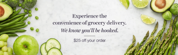 Fresh green produce surrounds the text offering $25 off grocery delivery with Amazon Fresh on a marble background.