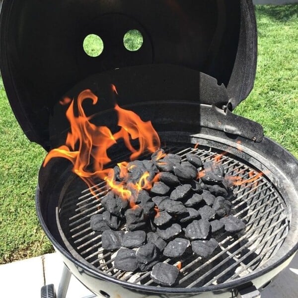 cooking pizza on charcoal grill