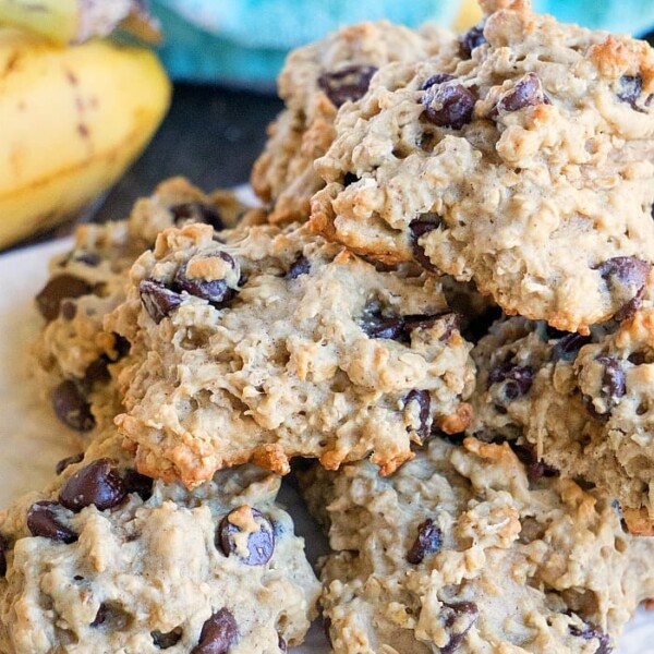 A plate of chunky chocolate chip banana cookies with oatmeal.