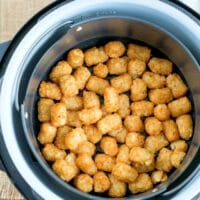 Golden and crispy, these air fryer tater tots are perfectly cooked to perfection in the basket.