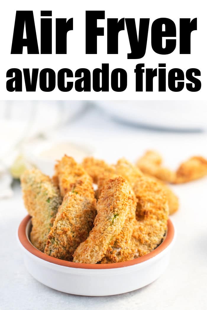 A small white bowl brimming with golden-brown air fryer avocado fries sits invitingly on a light surface. Bold black text above exclaims, "Air Fryer Avocado Fries.