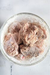 Raw firecracker chicken wings, coated in flour, are perfect for turning into air fryer delights.