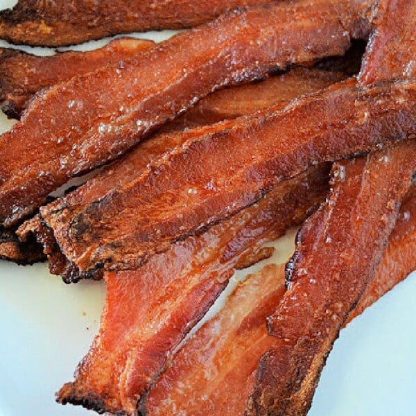 A plate of crispy bacon strips, prepared from frozen, shows the satisfying result of mastering how to cook frozen bacon perfectly.