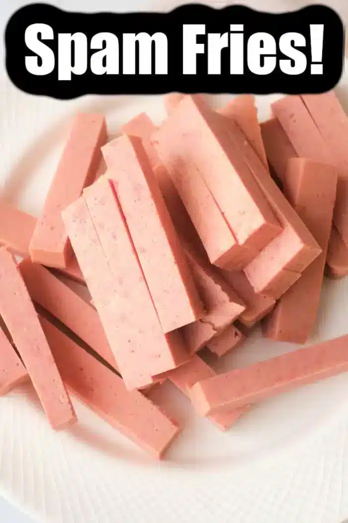 A white plate showcases pinkish rectangular strips resembling fries, made from spam. A bold black and white label confidently announces "Delicious Spam Fries!