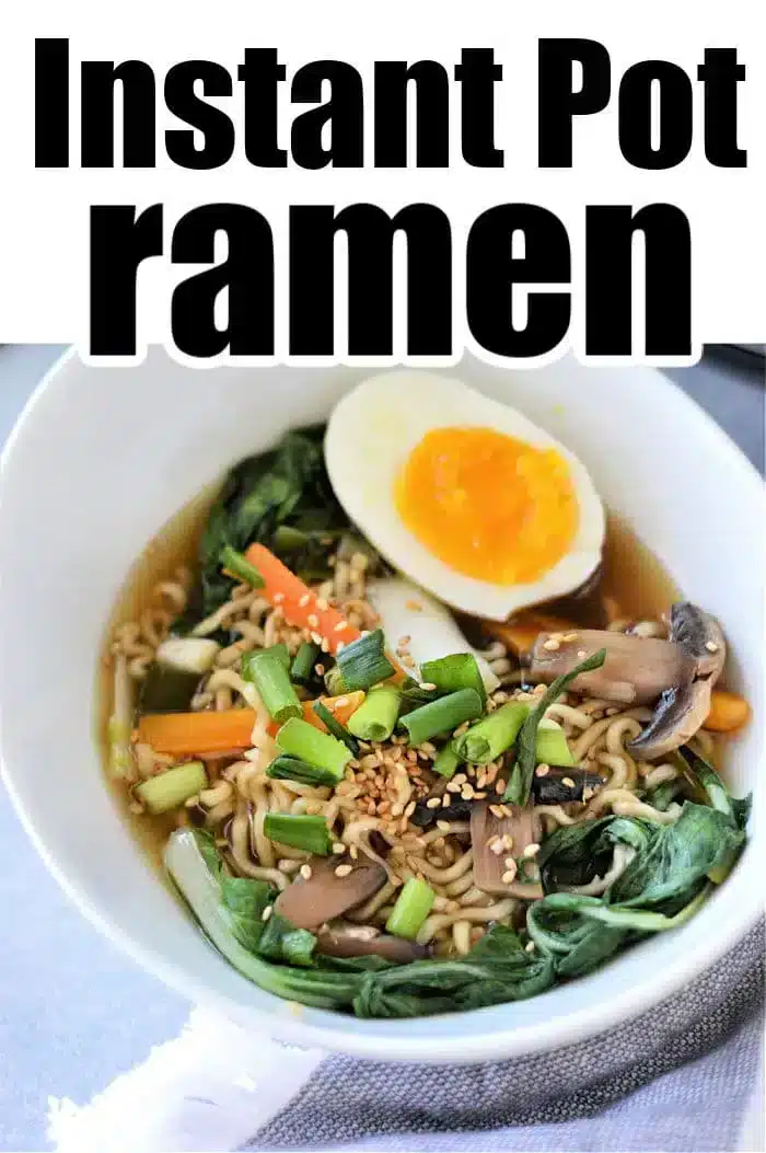 A bowl of Instant Pot Vegetable Ramen, topped with a halved soft-boiled egg, green onions, mushrooms, carrots, and greens. The image showcases text at the top reading "Instant Pot ramen.