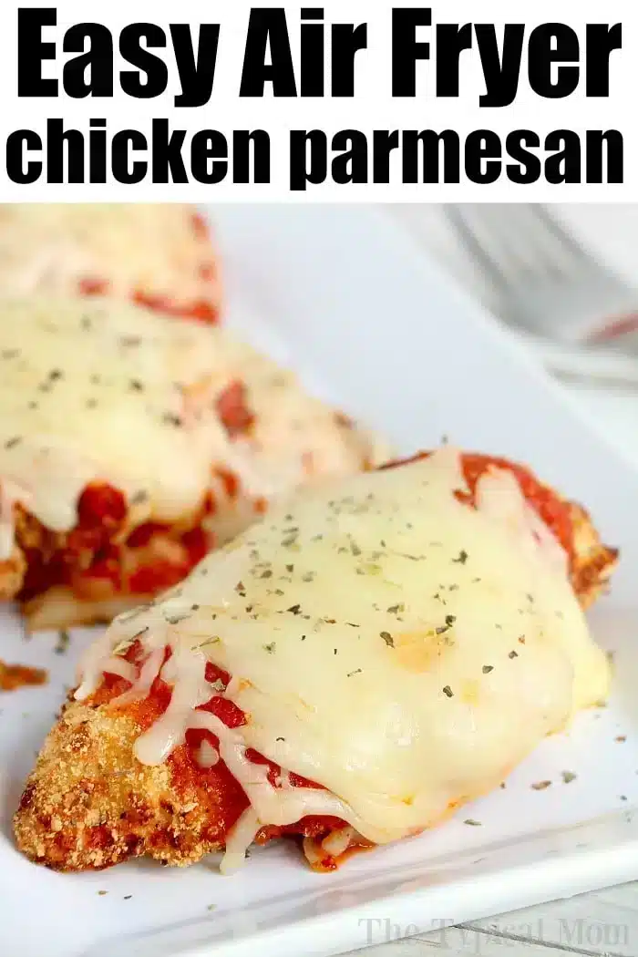 Close-up of air fryer chicken parm, topped with melted cheese and herbs on a white plate. The text at the top reads "Easy Air Fryer chicken parmesan.