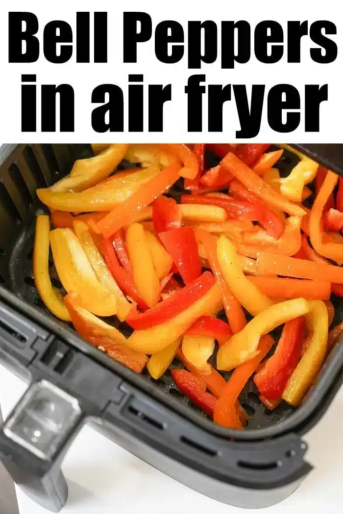 Sliced red, yellow, and orange air fryer peppers are delicately arranged inside the basket, ready for cooking. The text "Bell Peppers in Air Fryer" elegantly adorns the top of the image.