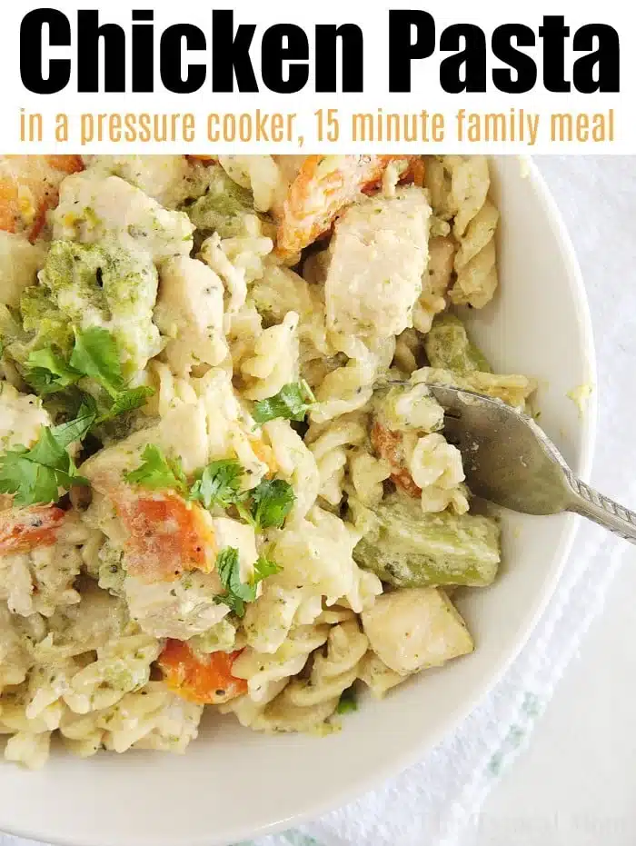 A bowl of instant pot chicken pasta with creamy sauce, featuring pieces of chicken, broccoli, and carrots. The dish is garnished with fresh herbs. The text reads, Chicken Pasta in a pressure cooker, 15-minute family meal.