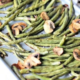 Sheet pan green beans and mushrooms roast to perfection, creating a delightful medley of textures and flavors.