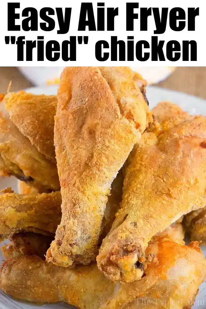 A plate of several air-fried chicken drumsticks is shown. The drumsticks are golden brown and crispy, arranged in a pile on a white plate. The text "Easy Air Fryer Fried Chicken Recipe" is prominently displayed at the top of the image.