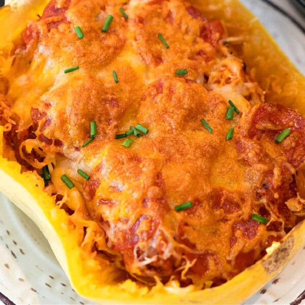 Air fryer pizza with spaghetti squash, showing crispy edges and a cheesy, golden topping.