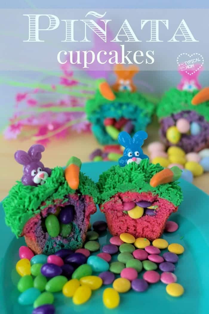 Surprise Inside Cupcakes reveal colorful treats with bunny and carrot decorations. These delightful creations are filled with hidden candies, displayed on a plate surrounded by loose sweets and flowers.