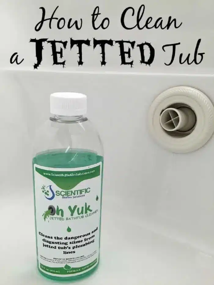 A bottle of Oh Yuk Jetted Bathtub Cleaner sits inside a bathtub. The label declares it cleans the dangerous and disgusting slime from jetted tubs' plumbing lines. Above the tub, the text reads, "How to Clean a Jetted Tub." Perfect for anyone interested in cleaning a jetted tub efficiently.