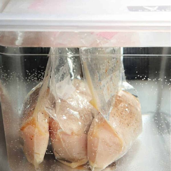 Learn how to sous vide chicken breast boneless by simply placing the vacuum-sealed bags of chicken in a water bath. This technique ensures perfectly cooked, juicy results every time.