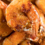 Golden, crispy air fryer fried shrimp take center stage in this close-up shot, highlighting the beautifully seasoned breading and perfect texture.