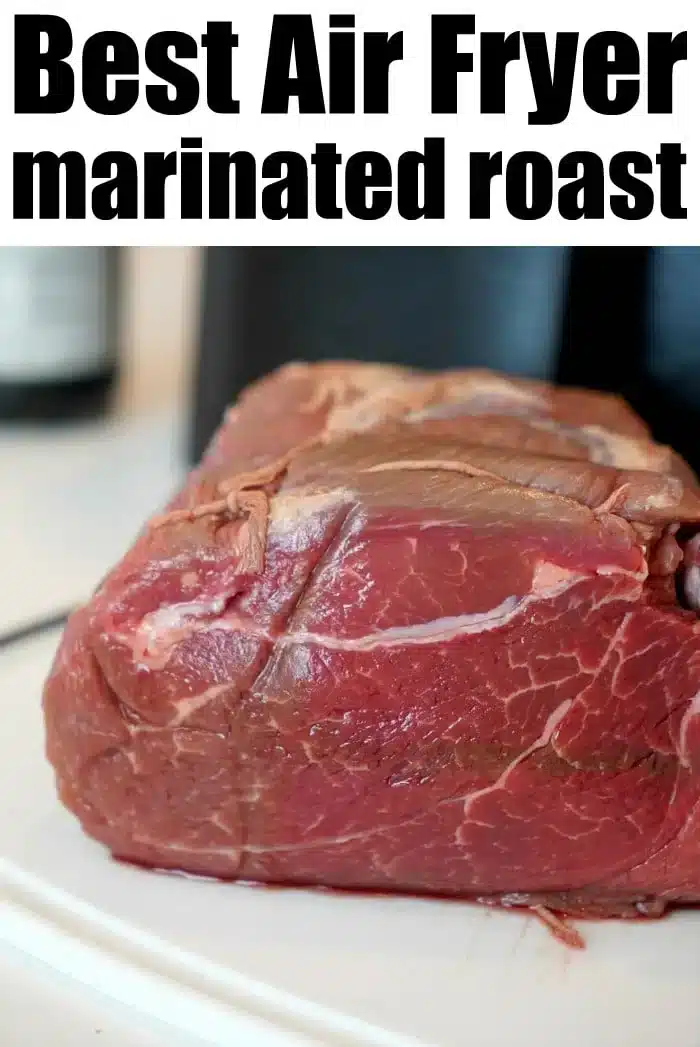 Raw marinated roast beef on a white surface with text above reading "Best Air Fryer Roast: Experience the Perfect Air Fryer Roast Beef.