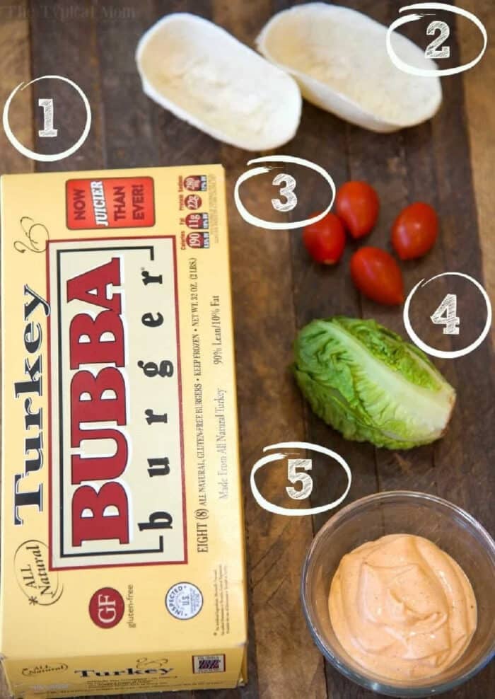 A box of turkey burgers and a bowl of sauce, perfect for making delicious turkey burger boats.