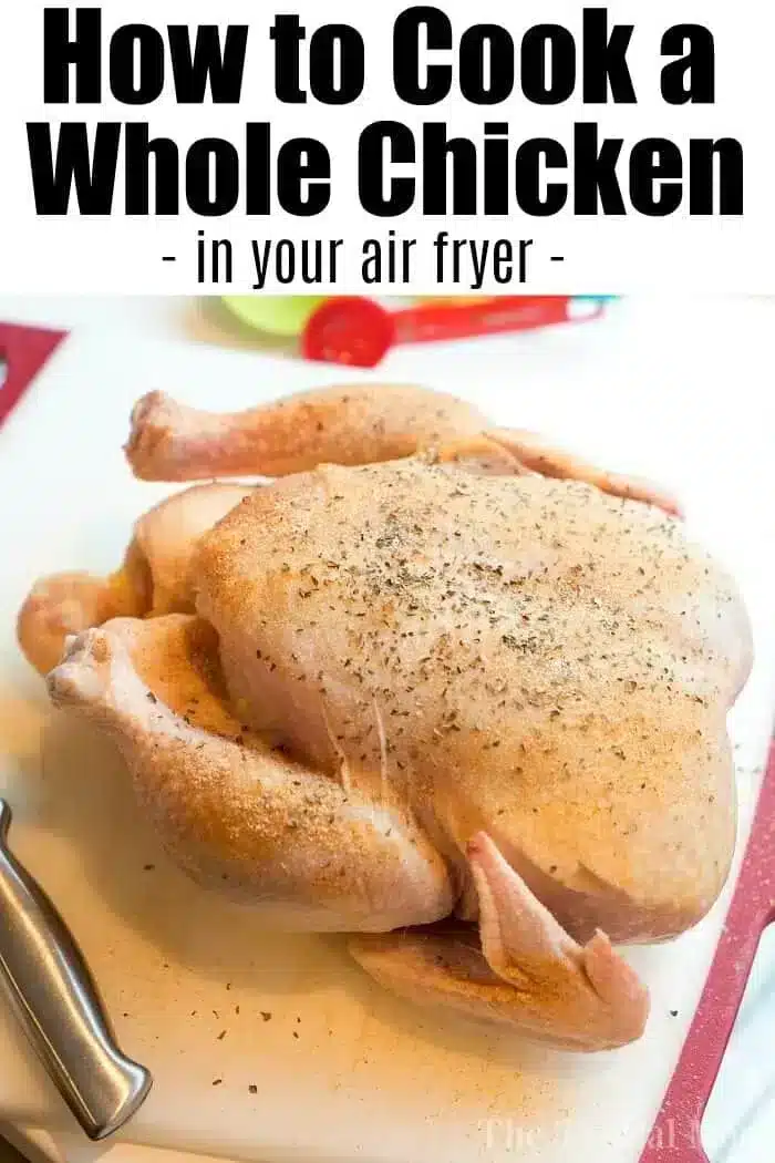 A seasoned raw whole chicken is placed on a cutting board with a knife nearby. The text on the image reads, "How to Cook an Air Fryer Whole Chicken."