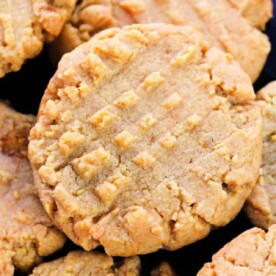 Close-up of the best ever peanut butter cookies with crisscross fork marks on top.