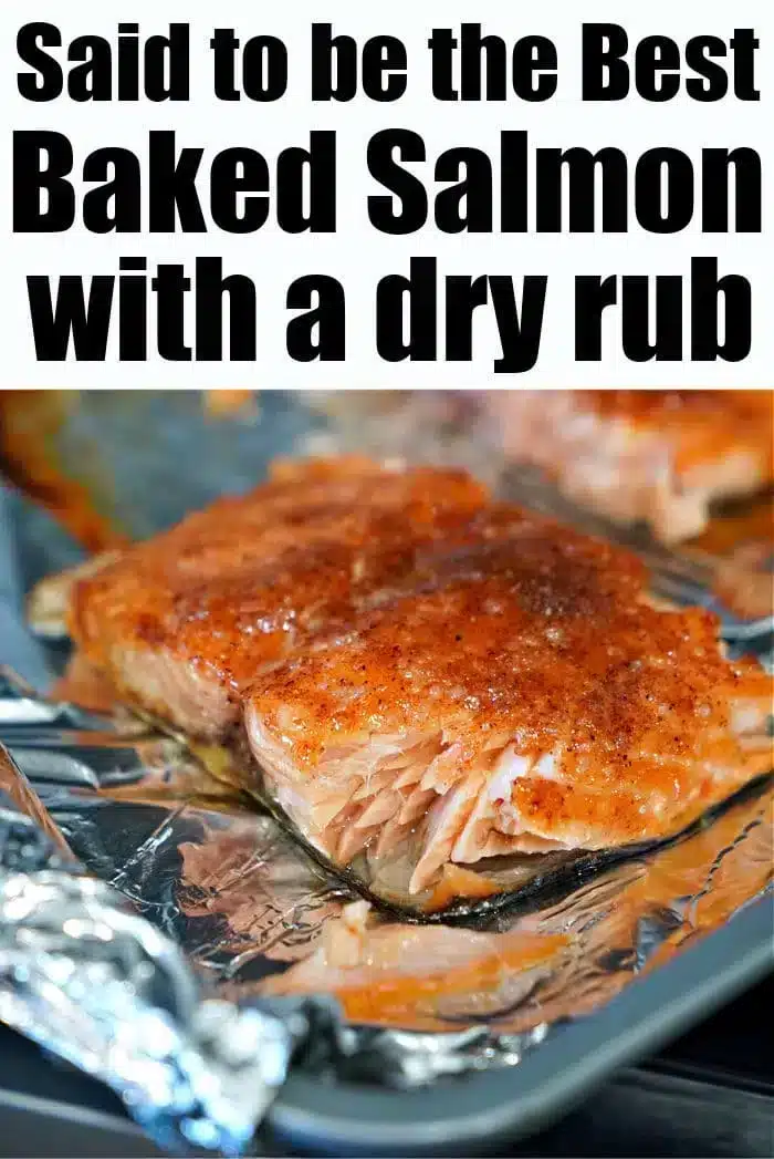 Close-up of the best baked salmon, seasoned with a savory dry rub, resting on a foil-lined baking sheet. The text on the image reads, "Said to be the Best Baked Salmon with a dry rub.