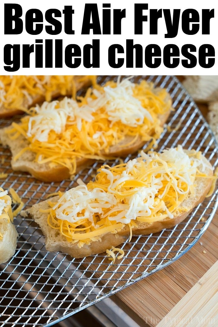 Open-faced bread slices topped with shredded cheese are arranged on an air fryer rack, perfect for making grilled cheese in air fryer style.