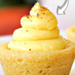 Close-up of a cookie cup filled with swirled cream and sprinkled spices. The text reads How to Make Delicious Cookie Cups.