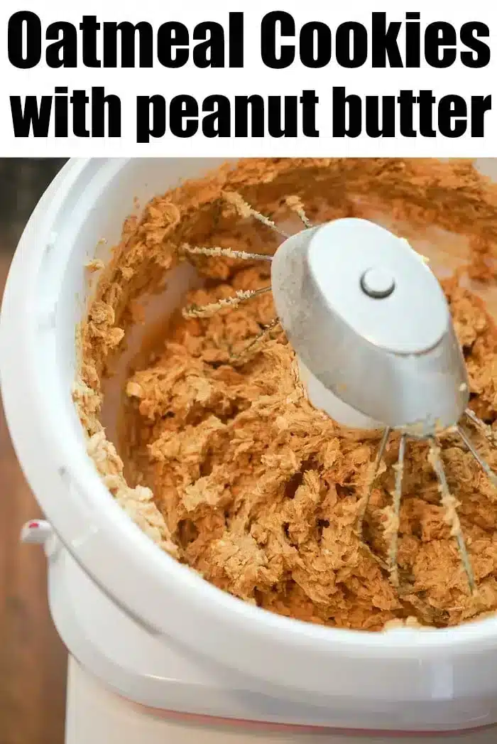 A stand mixer bowl filled with a mixture of oatmeal cookie dough and peanut butter is shown from above. The text at the top reads, "Peanut Butter Oatmeal Cookie Recipe.