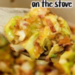 A wooden spoon holds a serving of fried cabbage and bacon over a pan filled with the same dish. The text above the image reads, "Cabbage and Bacon Recipe on the stove." The dish is a mixture of cooked cabbage pieces and bacon bits.