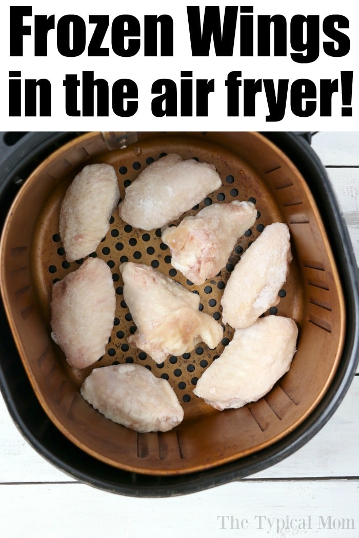 Frozen chicken wings in an air fryer basket, ready to be perfectly cooked, promise a crispy delight with minimal effort.