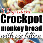A serving of crockpot cinnamon roll monkey bread with cherry pie filling and icing is being scooped from a crockpot.