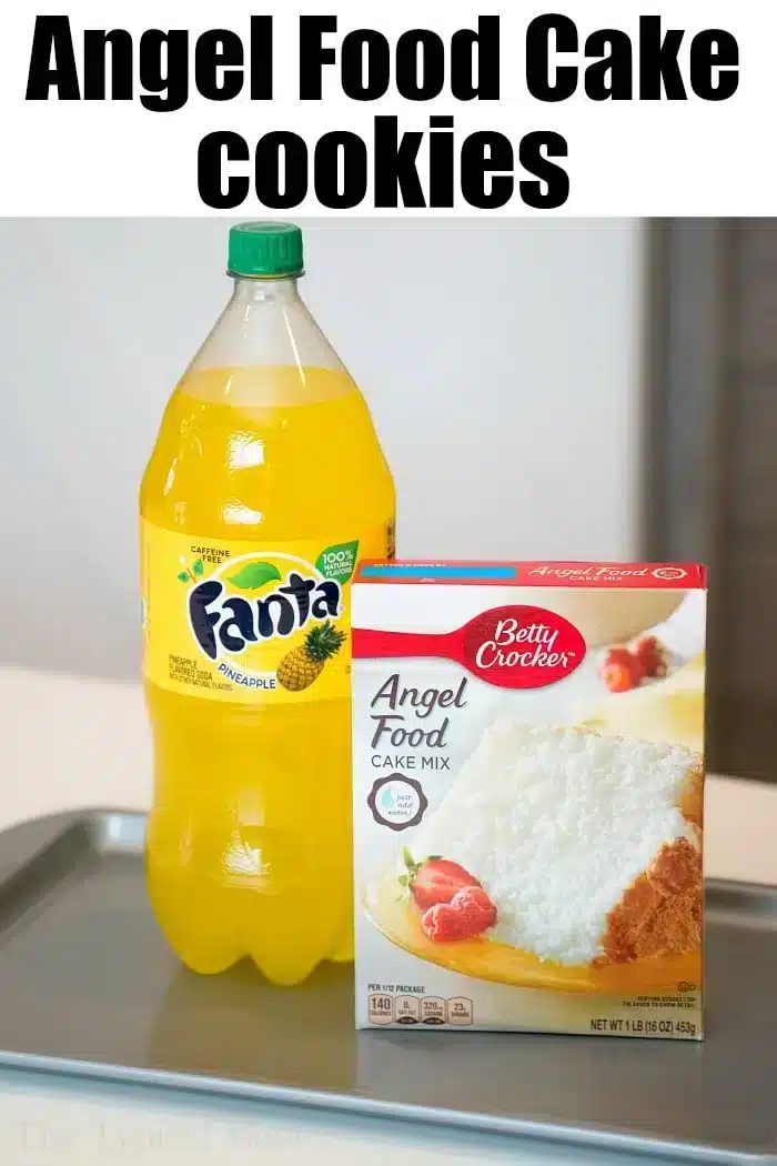 A bottle of Fanta Pineapple soda and a box of Betty Crocker Angel Food Cake Mix are placed on a kitchen counter.