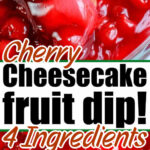 Close-up of a wafer dipped in creamy cherry cheesecake dip, topped with bright red cherry sauce.