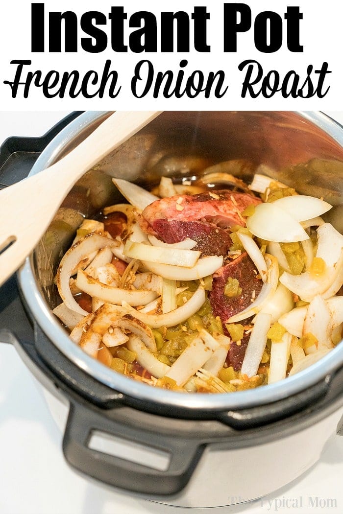 French onion pressure cooker roast is tender with tons of flavor. Perfect Instant Pot shredded beef tacos for dinner even your kids will rave about. #instantpotrecipes #instantpot #roast #frenchonion #tacos #shreddedbeef #ninjafoodirecipes #crockpotexpressrecipes #pressurecookerrecipes Sliced onions and roast beef in an Instant Pot, ready to cook for a delicious French onion pressure cooker roast, with a wooden spatula resting on top.