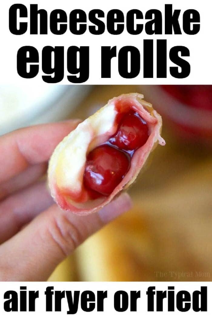 A hand holds a cheesecake egg roll filled with cherries and cream, highlighting delicious recipes using egg roll wrappers—perfect for air fryer or fried options.