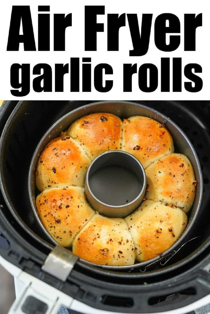 Golden garlic rolls arranged in a ring, baking in an air fryer basket—perfect for making Frozen Rolls in Air Fryer with ease. Text reads: Air Fryer garlic rolls.