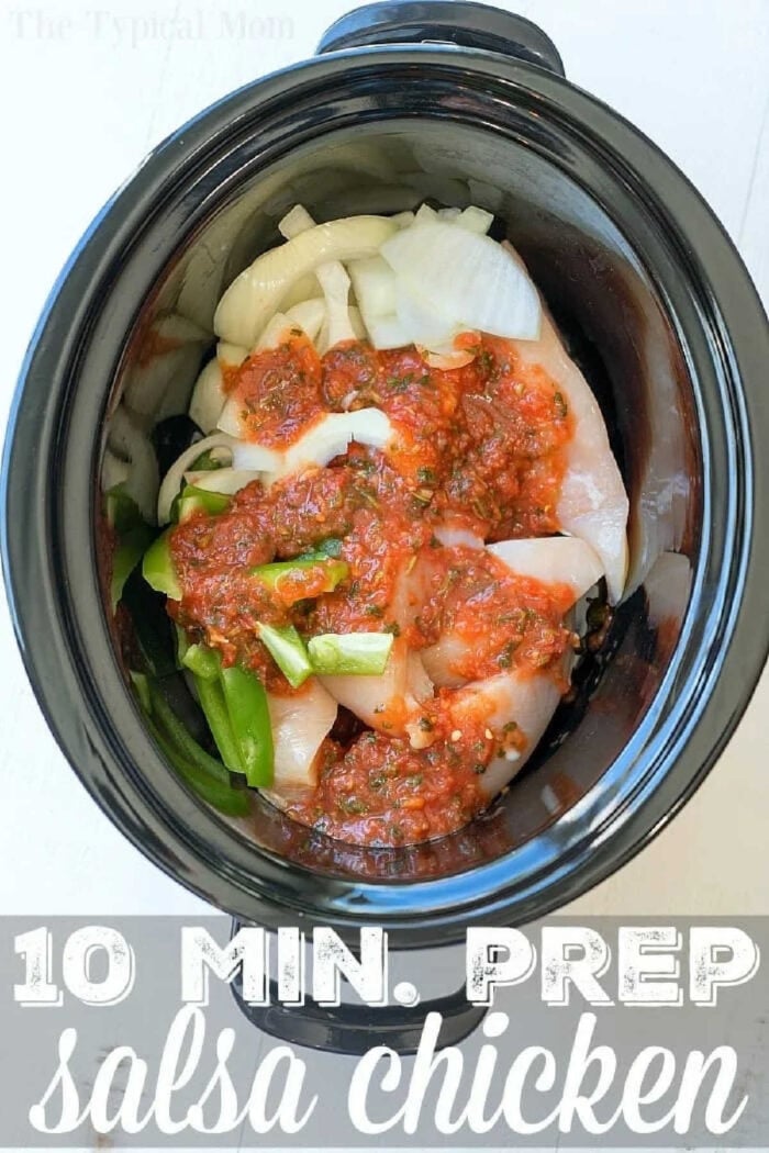 Salsa chicken crockpot recipe that only requires a few ingredients and is a healthy slow cooker dinner for sure! Shred it and make tacos or serve it on top of rice for a delicious meal packed with vegetables. If you need an easy family friendly dinner that is inexpensive but super flavorful this is it. #crockpot #slowcooker #salsachicken #chicken #healthy #salsa #crockpotrecipes #thetypicalmom Raw chicken, sliced onions, green peppers, and salsa in a slow cooker—your easy salsa chicken crockpot recipe. Just 10 minutes of prep!.
