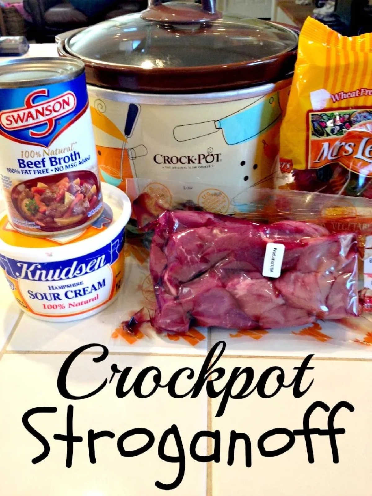 Crockpot beef stroganoff that only requires 5 ingredients and cooks all day in the crockpot. The best way to make tender beef with a creamy sauce. #crockpot #slowcooker #beefstroganoff #beef #stew Crockpot beef stroganoff ingredients—beef broth, sour cream, noodles, and tender beef—arranged on a counter and ready for your next cozy meal.