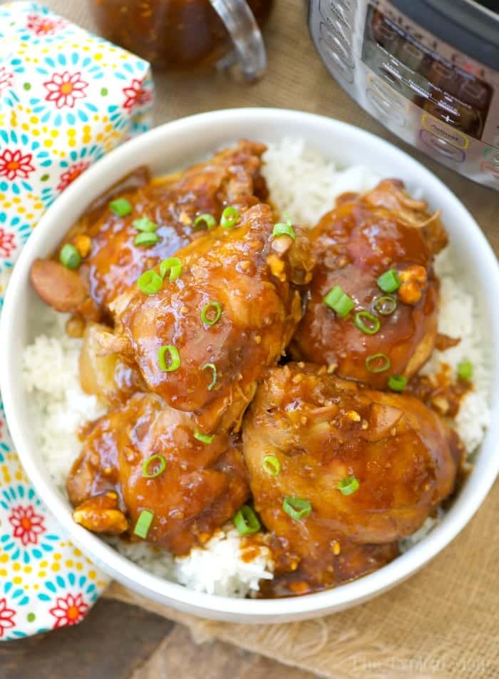 Homemade Instant Pot teriyaki chicken thighs. #instantpot #chickenthighs #chicken #teriyaki Glazed chicken thighs served over white rice, garnished with green onions; a simple instant pot dinner recipe.