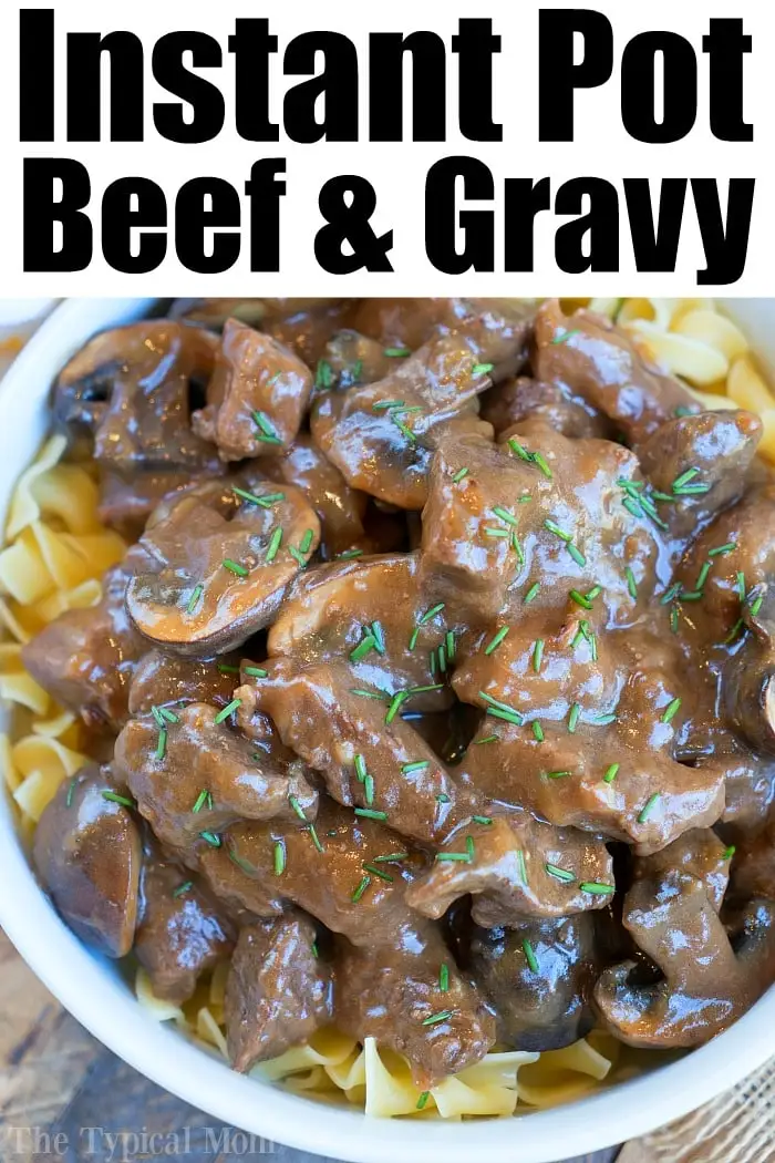 A bowl of egg noodles topped with succulent beef arm roast and rich gravy, garnished with herbs. The text above reads "Instant Pot Beef & Gravy".