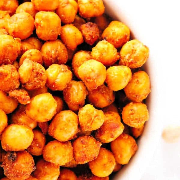 A bowl filled with crispy, air fryer chickpeas seasoned with flavorful spices.