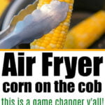 Air fryer corn on the cob, one ear held with tongs and others topped with seasoning and cheese, makes an irresistible side dish.