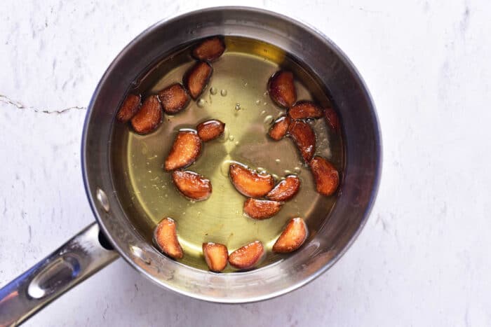 garlic confit on stove