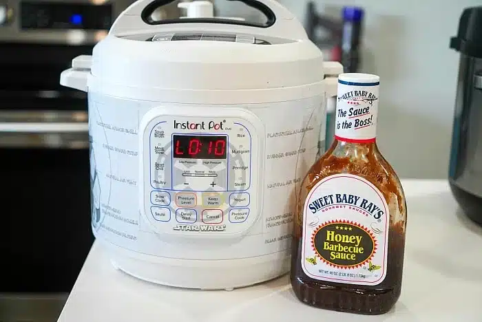 A Star Wars-themed Instant Pot sits on the kitchen counter alongside a bottle of Sweet Baby Ray's Honey Barbecue Sauce&mdash;perfect for whipping up delicious instant pot BBQ beef.