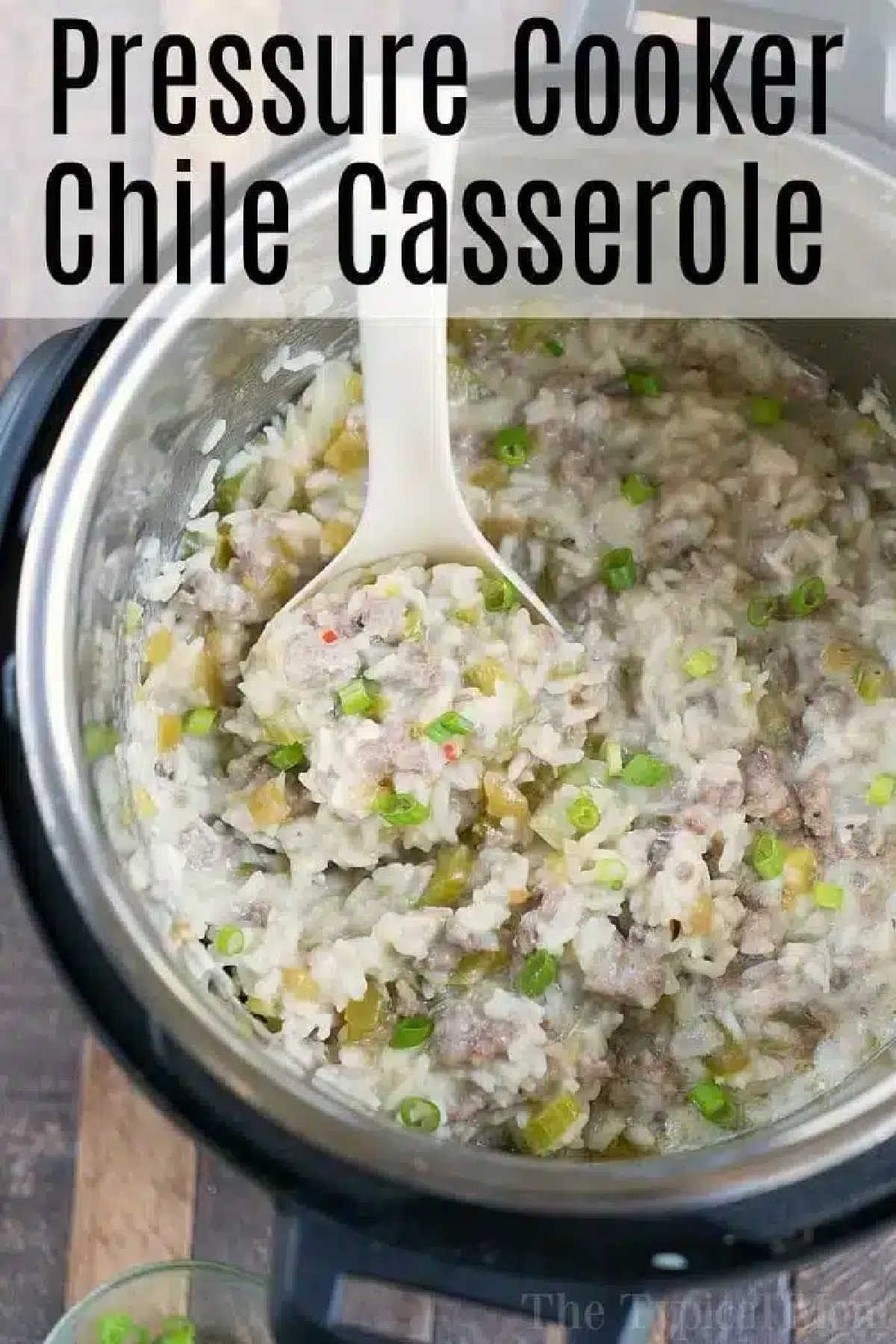 Instant Pot sausage rice casserole packed with flavor! All cooked in my Instant pot it's easy and tasty with hatch chiiles and much more! ad #instantpot #pressurecooker #casserole #sausage #hatchchile #rice #instantpotrecipes A spoon scoops instant pot sausage rice casserole with ground meat and chile from a pressure cooker, topped with chopped green onions.